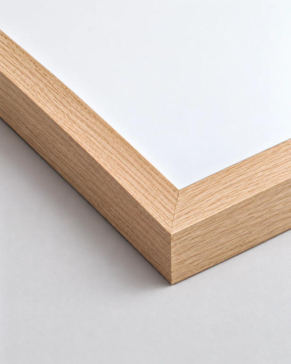 Natural Premium Oak frame, corner detail showing miter, profile and surface